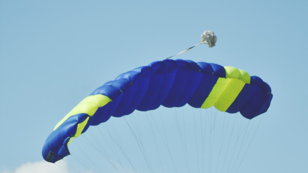 Picture of person flying with parachute.