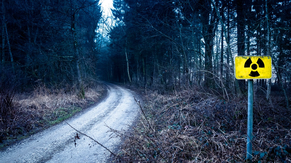 Pictured: abandoned road with danger sign