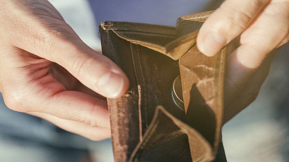 Picture of an open purse with a few coins inside