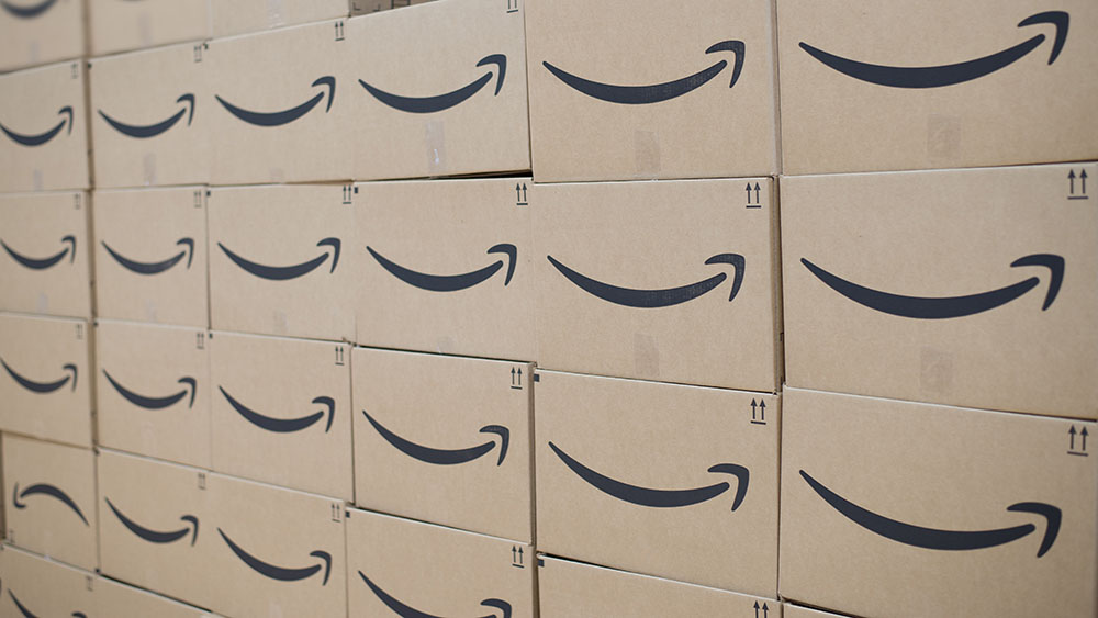 Rows of stacked cardboard boxes with Amazon logo